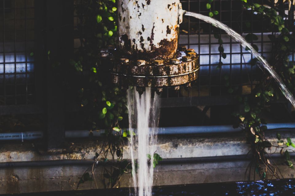 Water gushing out of a broken pipe