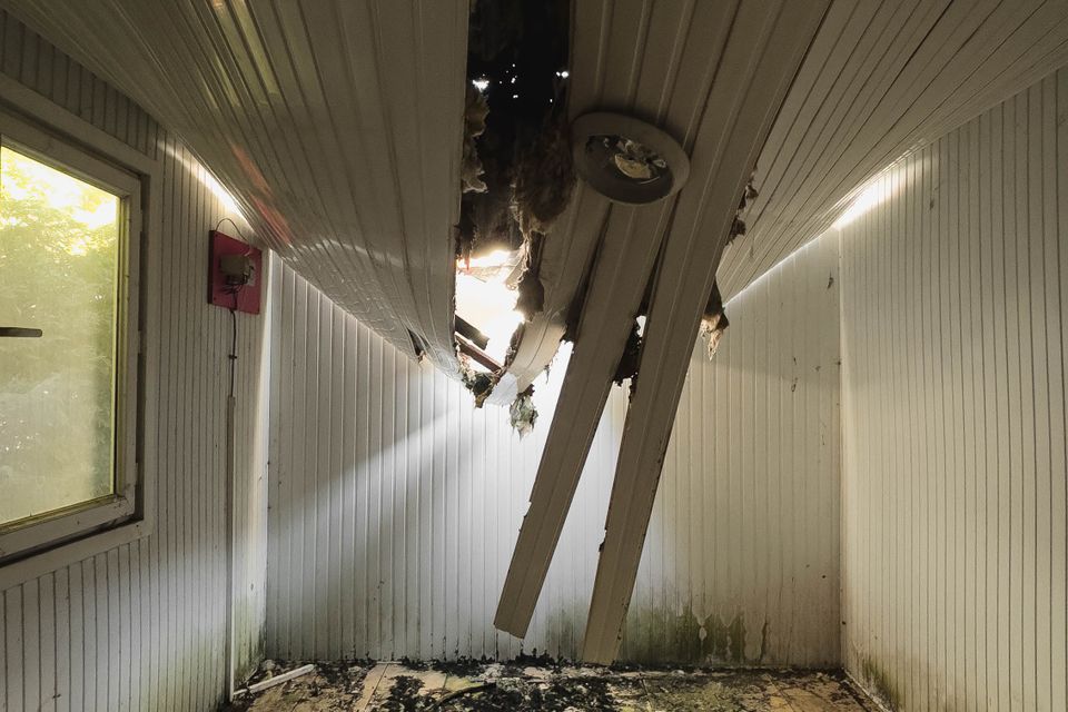 Room with a collapsed, water-damaged ceiling