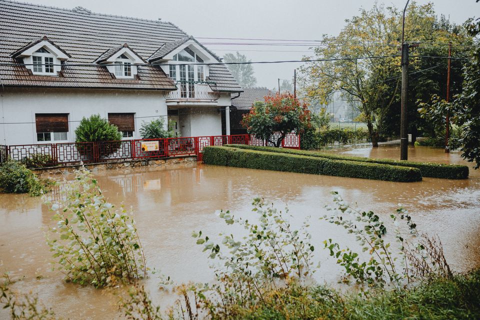 Suburban house with a flooded yard after heavy rain