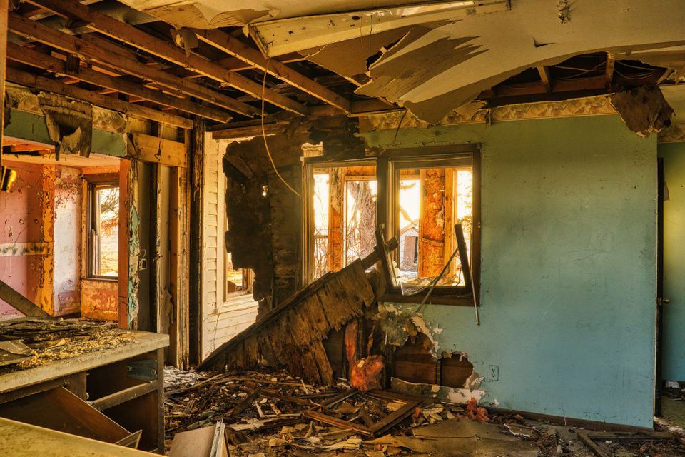 Damaged room with the ceiling opened to the joists